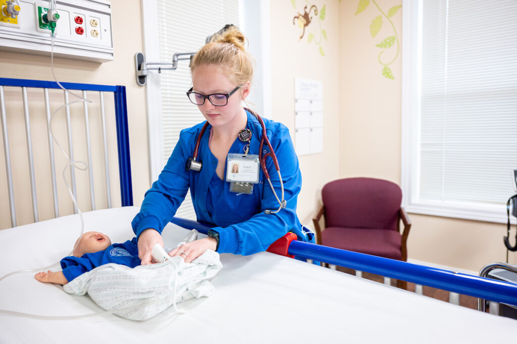 Nursing student testing on a dummy