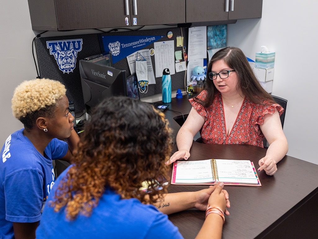 Two female students receiving support at the Mosher Success Center