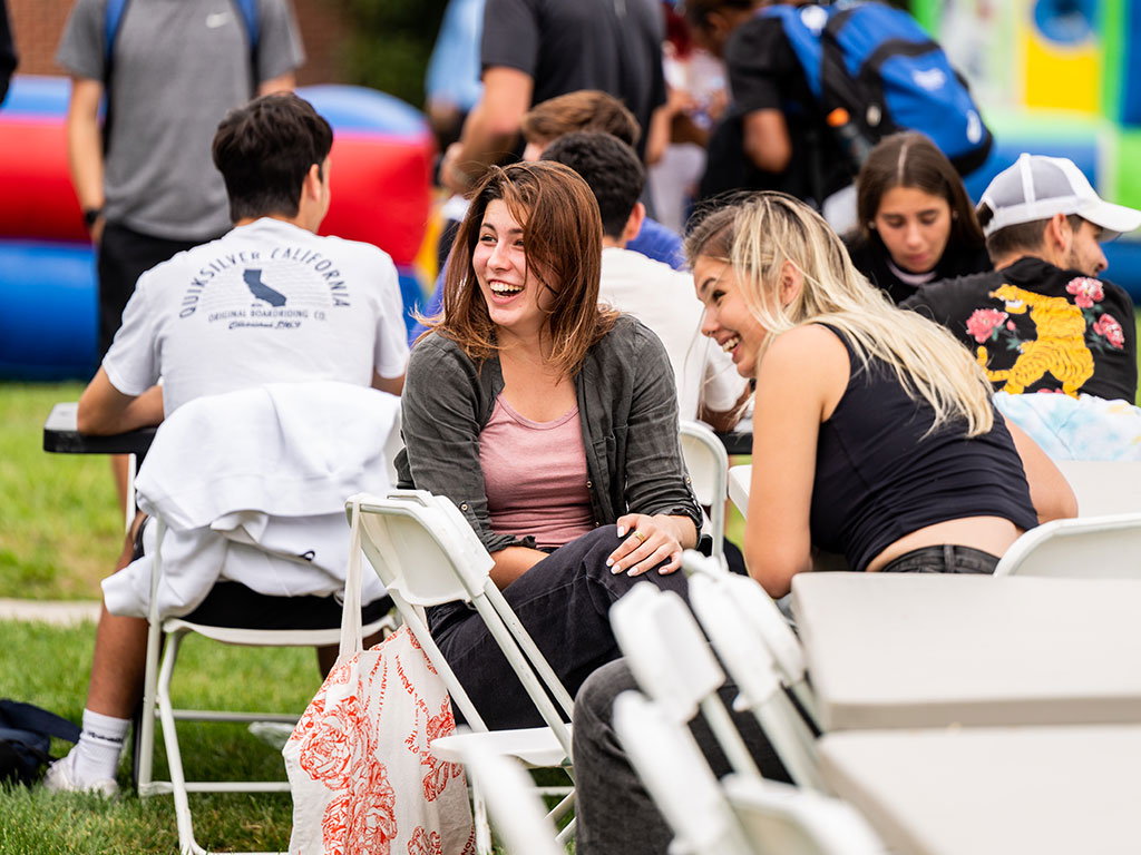 Two female students enjoying Bulldog Bash at TWU