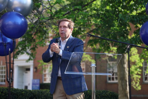 Congressman Fleischmann stands at the podium to address the audience in attendance.