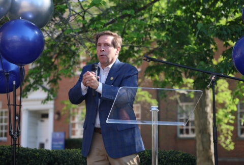 Congressman Fleischmann stands at the podium to address the audience in attendance.