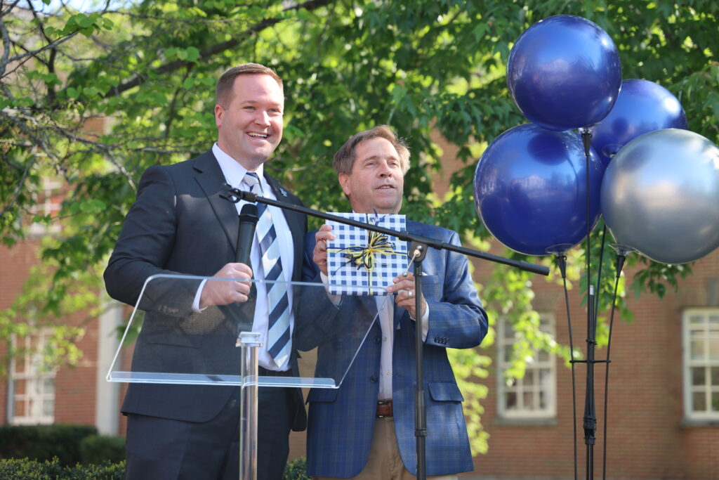 Tyler Forrest presents Congressman Fleischmann with a gift from TWU in honor of his trip to McMinn County.