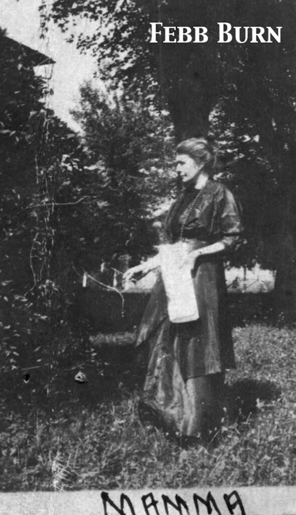 | Tennessee Wesleyan University Black-and-white photo of a woman in a long skirt and blouse standing outdoors beside a tree, facing to the right, with foliage in the background. A caption reading 'Mamma' appears at the bottom.