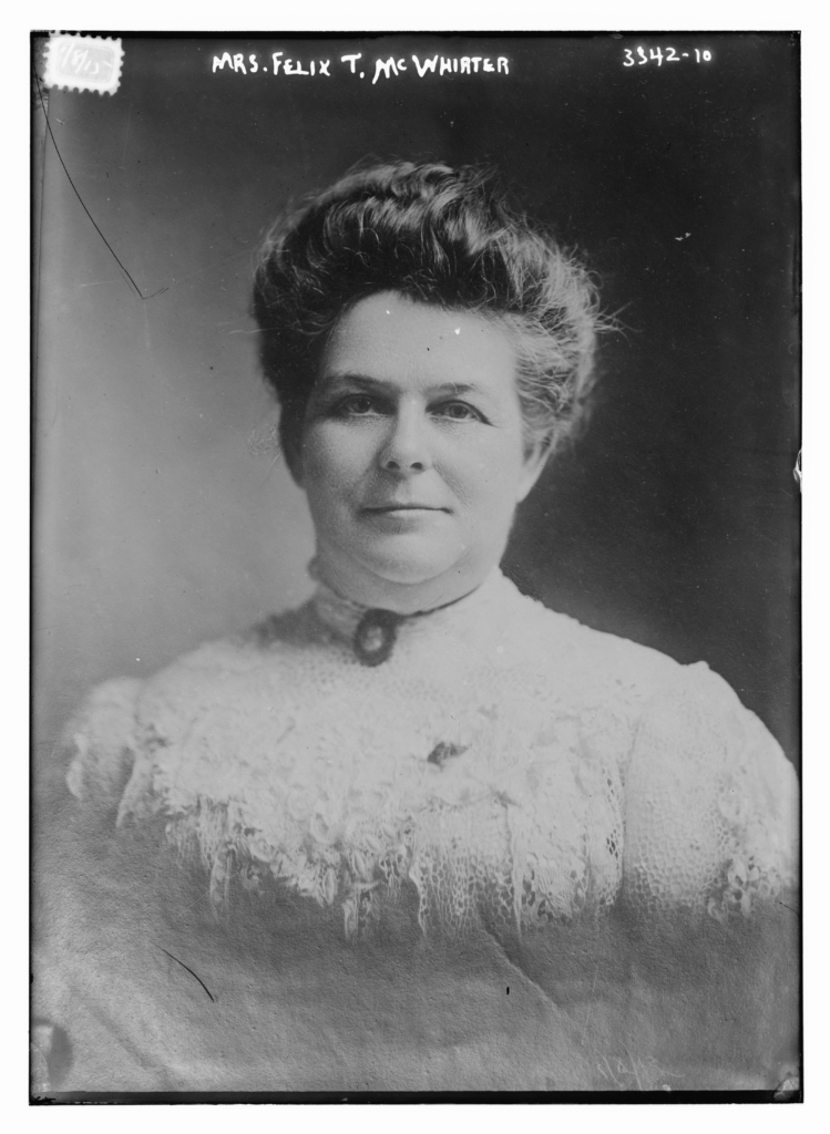 | Tennessee Wesleyan University Black-and-white studio portrait of a woman with a high lace collar; handwritten name 'Mrs. Felix T. McWhorter' at the top.