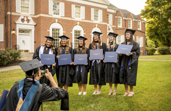 newly grads in front of lawrence hall